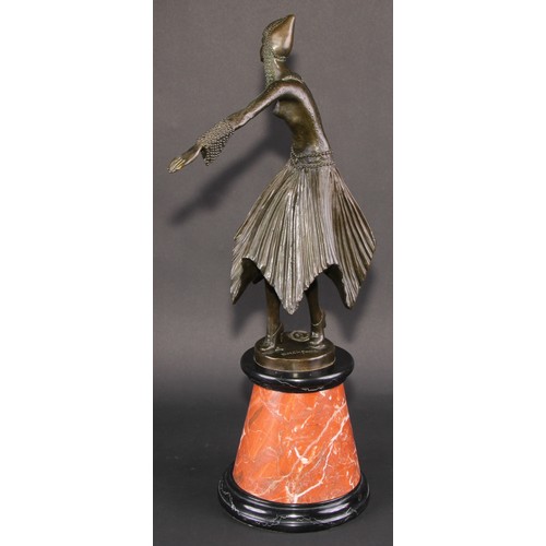 1639 - An Art Deco style dark patinated bronze, after Demétre Chiparus, dancing girl in cap with swirling s... 