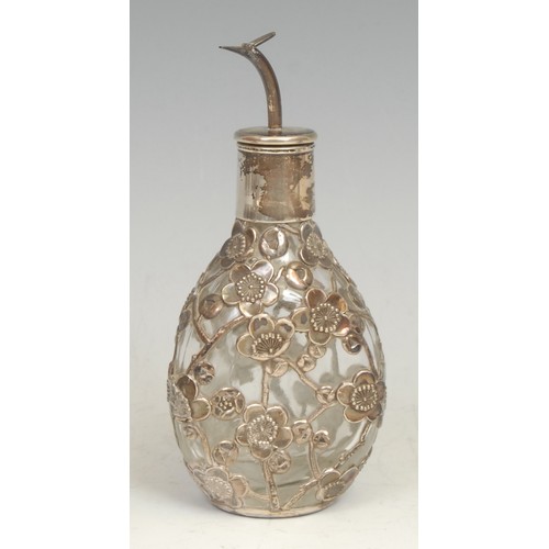 2118 - An Art Nouveau silver overlaid clear glass scent bottle, compressed ovoid form, conforming globular ... 