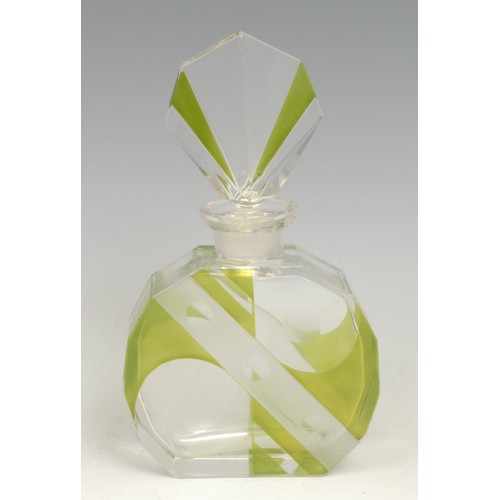 2117 - An Art Deco scent bottle, clear and lime green glass flashed, decorated with geometric shapes and ro... 