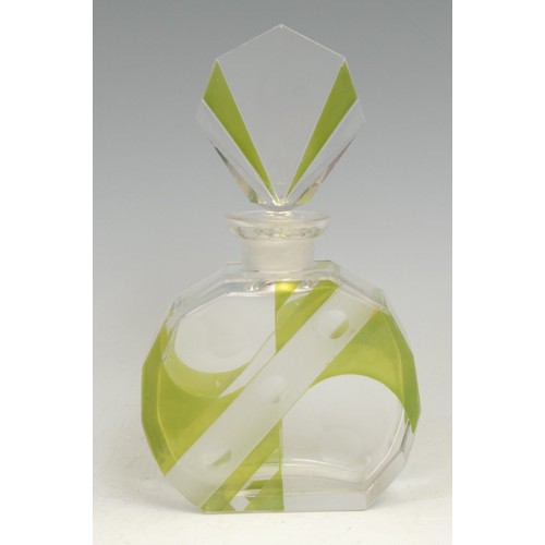 2117 - An Art Deco scent bottle, clear and lime green glass flashed, decorated with geometric shapes and ro... 