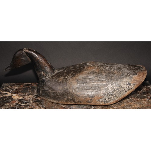 2090 - Folk Art -a North American/Canadian carved and painted decoy duck, as a goose, the full-bodied form ... 