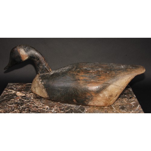 2091 - Folk Art -a North American/Canadian carved and painted decoy duck, as a goose, the full-bodied form ... 