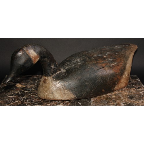 2091 - Folk Art -a North American/Canadian carved and painted decoy duck, as a goose, the full-bodied form ... 