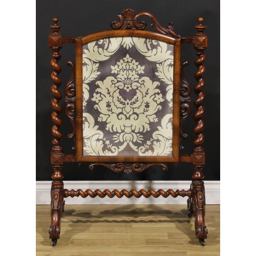 1476 - A Victorian mahogany fire screen, arched rectangular banner, spirally turned supports, cabriole legs... 