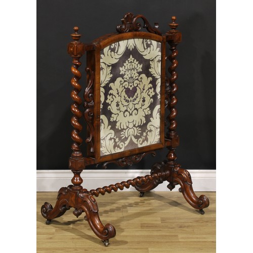 1476 - A Victorian mahogany fire screen, arched rectangular banner, spirally turned supports, cabriole legs... 