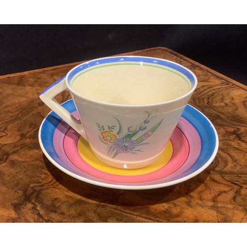 2 - A Clarice Cliff Bizarre Spring Crocus pattern teacup and saucer; another painted with coloured bands... 