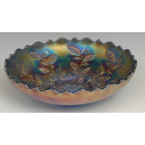 80 - An American Northwood Carnival glass electric blue shaped circular bowl, moulded in low relief with ... 