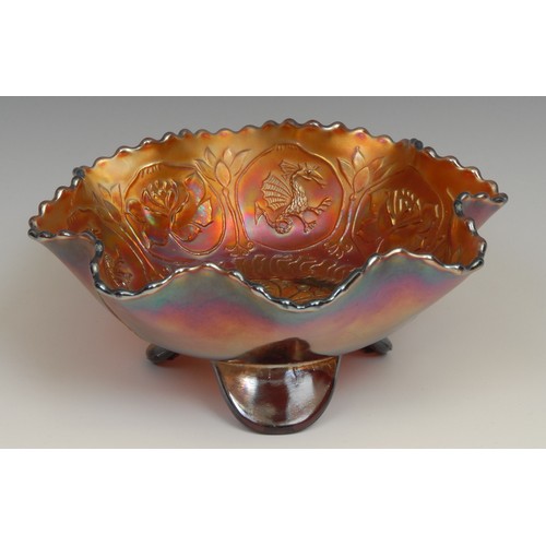 65 - A carnival amethyst glass fluted dish, moulded with dragons and roses in relief, 21cm diameter; a si... 