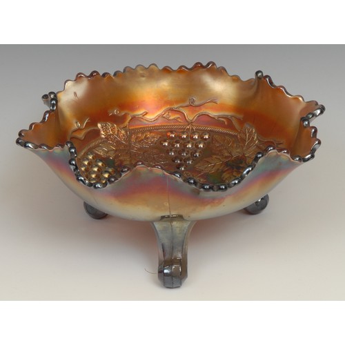 65 - A carnival amethyst glass fluted dish, moulded with dragons and roses in relief, 21cm diameter; a si... 