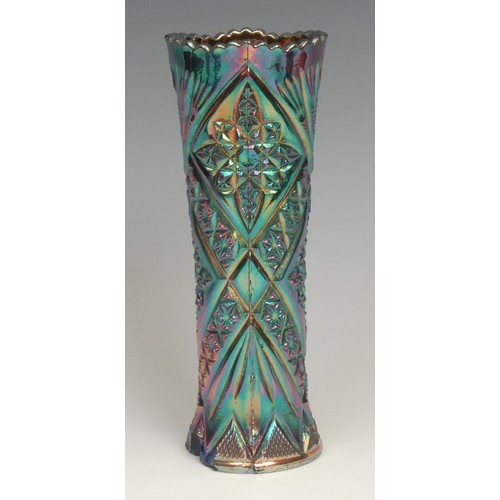 79 - An American Northwood amethyst carnival glass beaker, moulded with peacocks and fountains, 10cm, mou... 