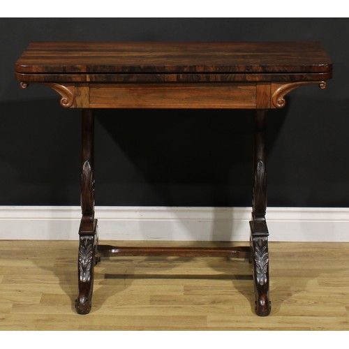 1568 - An unusual 19th century rosewood and mahogany card table, hinged top enclosing a baize lined playing... 