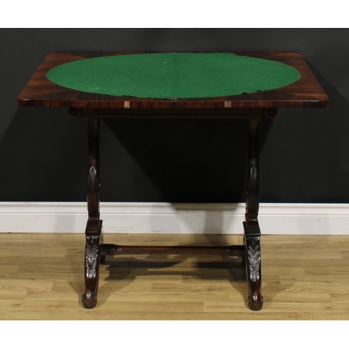 1568 - An unusual 19th century rosewood and mahogany card table, hinged top enclosing a baize lined playing... 