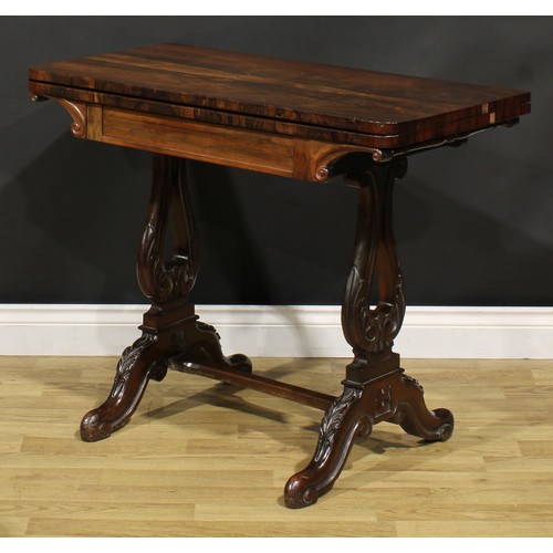 1568 - An unusual 19th century rosewood and mahogany card table, hinged top enclosing a baize lined playing... 