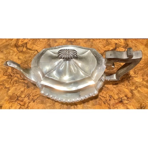 776 - An Edwardian silver half fluted three piece tea service, comprising teapot, sugar basin and cream ju... 