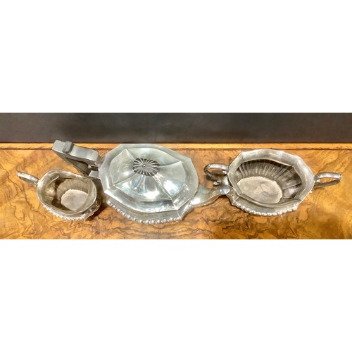 776 - An Edwardian silver half fluted three piece tea service, comprising teapot, sugar basin and cream ju... 