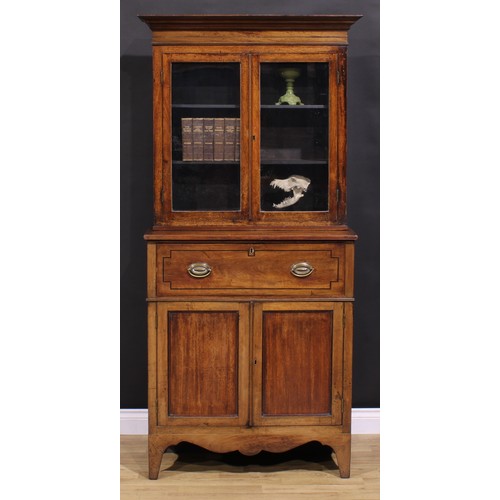 2173 - A Post-Regency mahogany secretaire bookcase, of neat proportions, outswept cornice above a pair of g... 