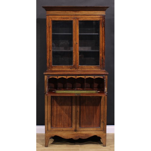 2173 - A Post-Regency mahogany secretaire bookcase, of neat proportions, outswept cornice above a pair of g... 