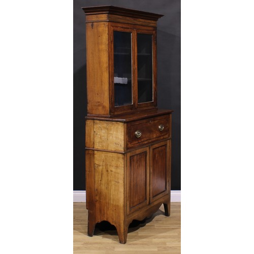 2173 - A Post-Regency mahogany secretaire bookcase, of neat proportions, outswept cornice above a pair of g... 