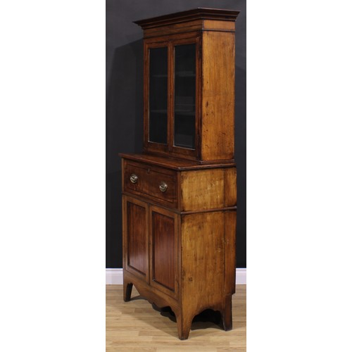 2173 - A Post-Regency mahogany secretaire bookcase, of neat proportions, outswept cornice above a pair of g... 