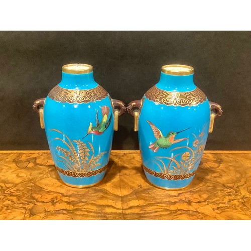 142 - A pair of Mintons Aesthetic Movement two-handled Chinoiserie vases, in the manner of Christopher Dre... 