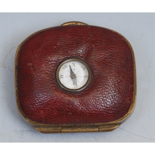 2149 - An unusual 19th century red leather coin purse, set with a compass, 5cm wide