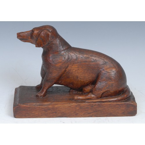 2089 - Folk Art - an oak carving, of a dachshund dog, rectangular base, 19cm wide, early 20th century