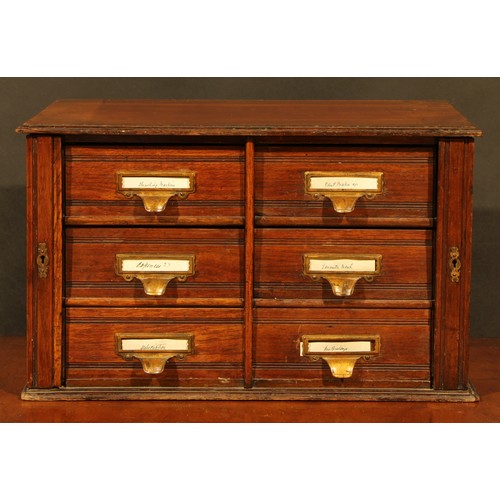 1846 - A late Victorian/Edwardian walnut table-top estate office filing chest, oversailing top above six dr... 