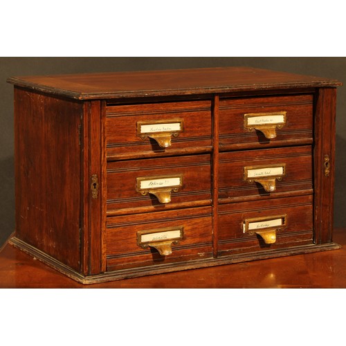 1846 - A late Victorian/Edwardian walnut table-top estate office filing chest, oversailing top above six dr... 