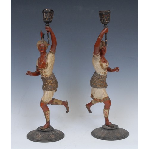 2138 - A pair of Continental cold painted spelter figural candlesticks, each cast in the Orientalist taste ... 