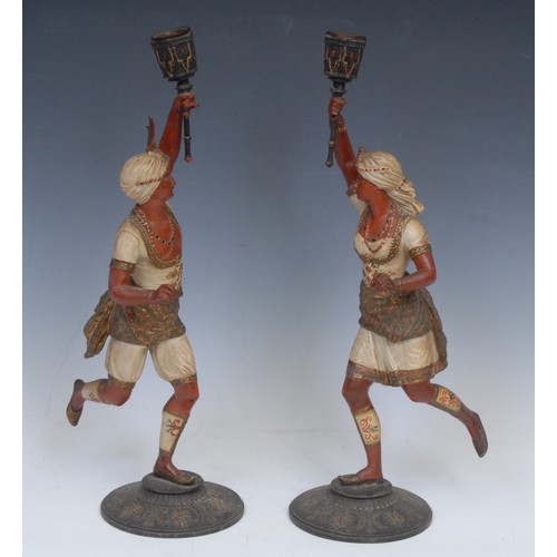 2138 - A pair of Continental cold painted spelter figural candlesticks, each cast in the Orientalist taste ... 