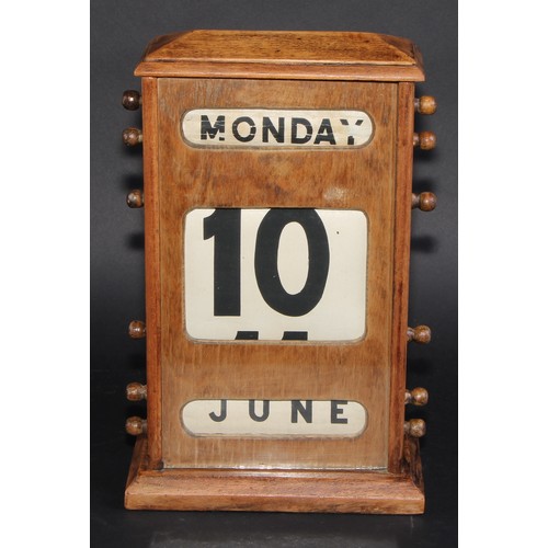 2042 - A large early 20th century mahogany perpetual desk calendar, 31cm high, c.1940