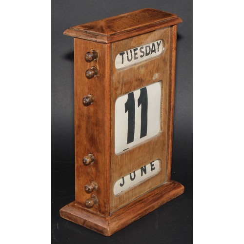 2042 - A large early 20th century mahogany perpetual desk calendar, 31cm high, c.1940