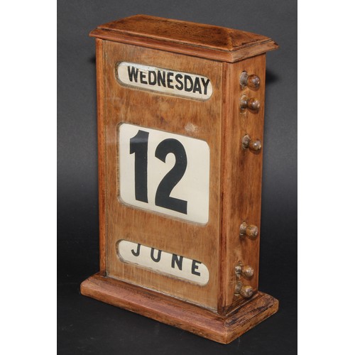 2042 - A large early 20th century mahogany perpetual desk calendar, 31cm high, c.1940