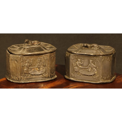 2084 - A pair of 19th century lead canted rectangular tobacco boxes and covers, recumbent dog finials, the ... 