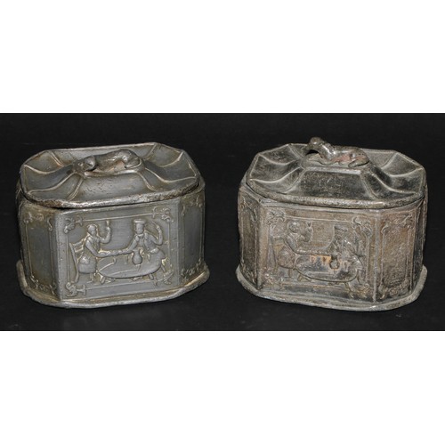 2084 - A pair of 19th century lead canted rectangular tobacco boxes and covers, recumbent dog finials, the ... 