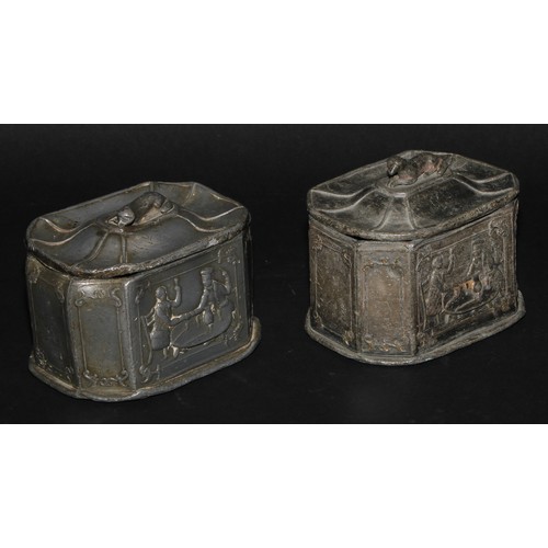 2084 - A pair of 19th century lead canted rectangular tobacco boxes and covers, recumbent dog finials, the ... 