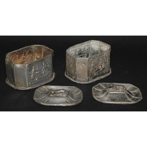 2084 - A pair of 19th century lead canted rectangular tobacco boxes and covers, recumbent dog finials, the ... 