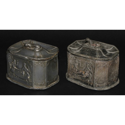 2084 - A pair of 19th century lead canted rectangular tobacco boxes and covers, recumbent dog finials, the ... 