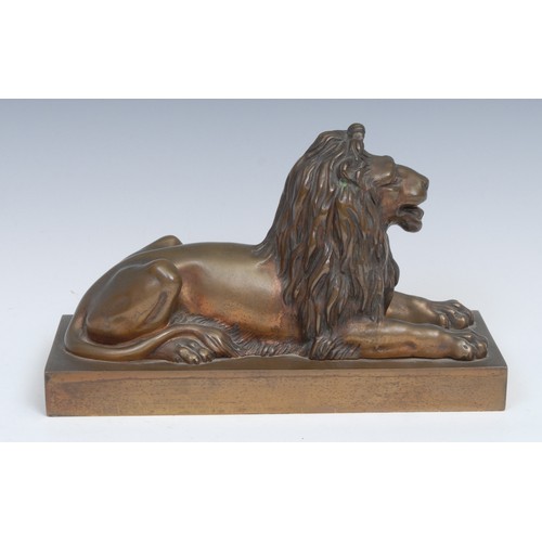 2095 - French School (early 20th century), a gilt patinated bronze, of a recumbent lion. rectangular base, ... 