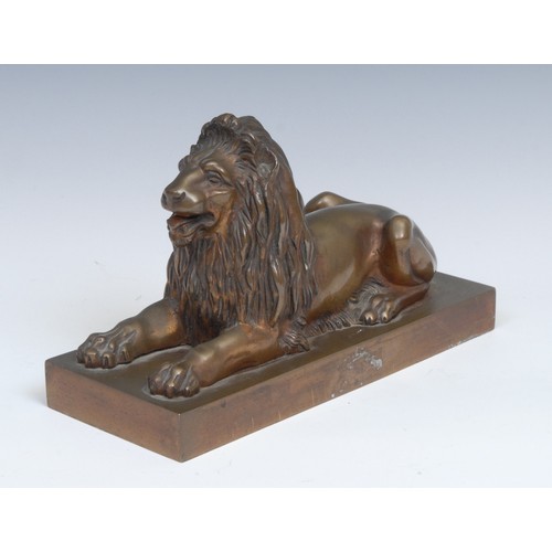 2095 - French School (early 20th century), a gilt patinated bronze, of a recumbent lion. rectangular base, ... 