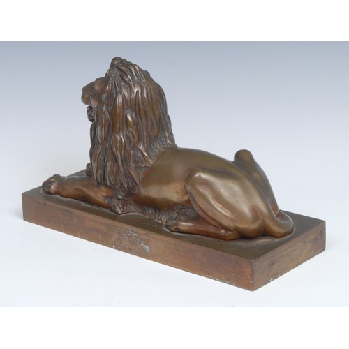 2095 - French School (early 20th century), a gilt patinated bronze, of a recumbent lion. rectangular base, ... 