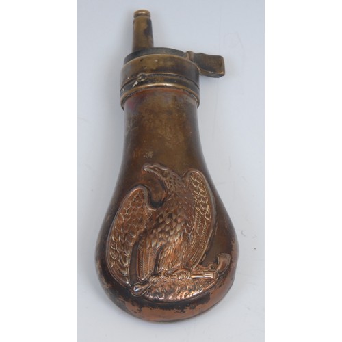 2525 - A copper and brass pistol powder flask, in the manner of Remington, embossed with an American eagle ... 