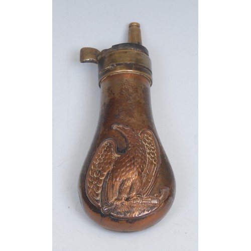 2525 - A copper and brass pistol powder flask, in the manner of Remington, embossed with an American eagle ... 