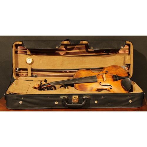 2561 - A violin, the two-piece back 35.5cm long excluding button, paper label printed Joseph Guarnerius, ro... 