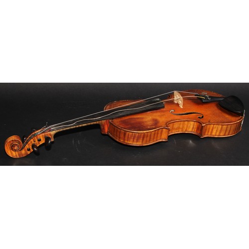 2561 - A violin, the two-piece back 35.5cm long excluding button, paper label printed Joseph Guarnerius, ro... 