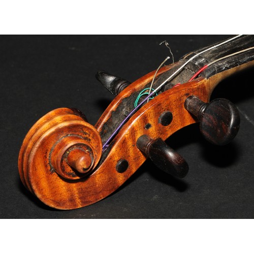 2561 - A violin, the two-piece back 35.5cm long excluding button, paper label printed Joseph Guarnerius, ro... 