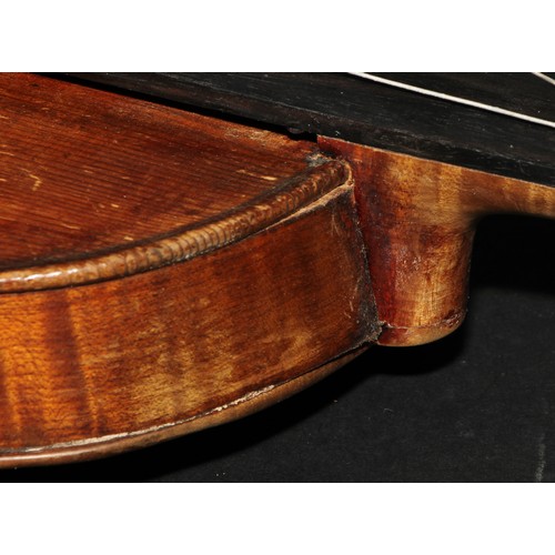 2561 - A violin, the two-piece back 35.5cm long excluding button, paper label printed Joseph Guarnerius, ro... 