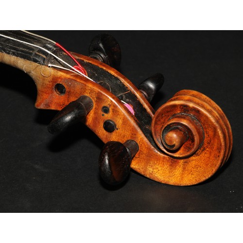 2561 - A violin, the two-piece back 35.5cm long excluding button, paper label printed Joseph Guarnerius, ro... 