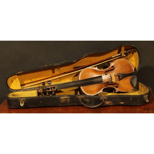 2558 - A violin, the one piece back 35.5cm long excluding button, ebonised tuning pegs, outlined throughout... 