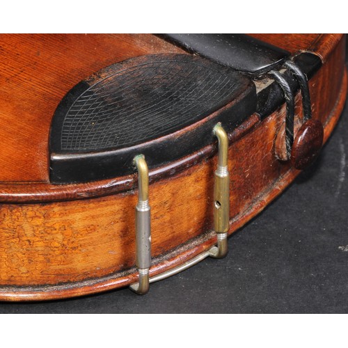 2558 - A violin, the one piece back 35.5cm long excluding button, ebonised tuning pegs, outlined throughout... 